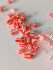Fiole de bonbons en coeur au cerise de couleurs rouge et blanc